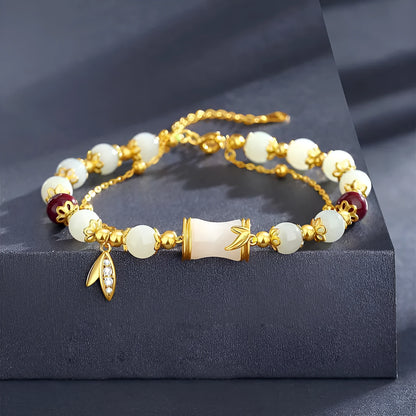 Retro bracelet with Ruyi flower design in glass and coloured glaze beads with electroplated accents