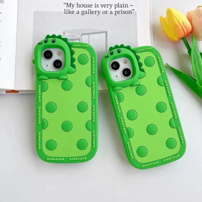 Green polka dot dinosaur silicone phone case showing back design and side protection for iPhone