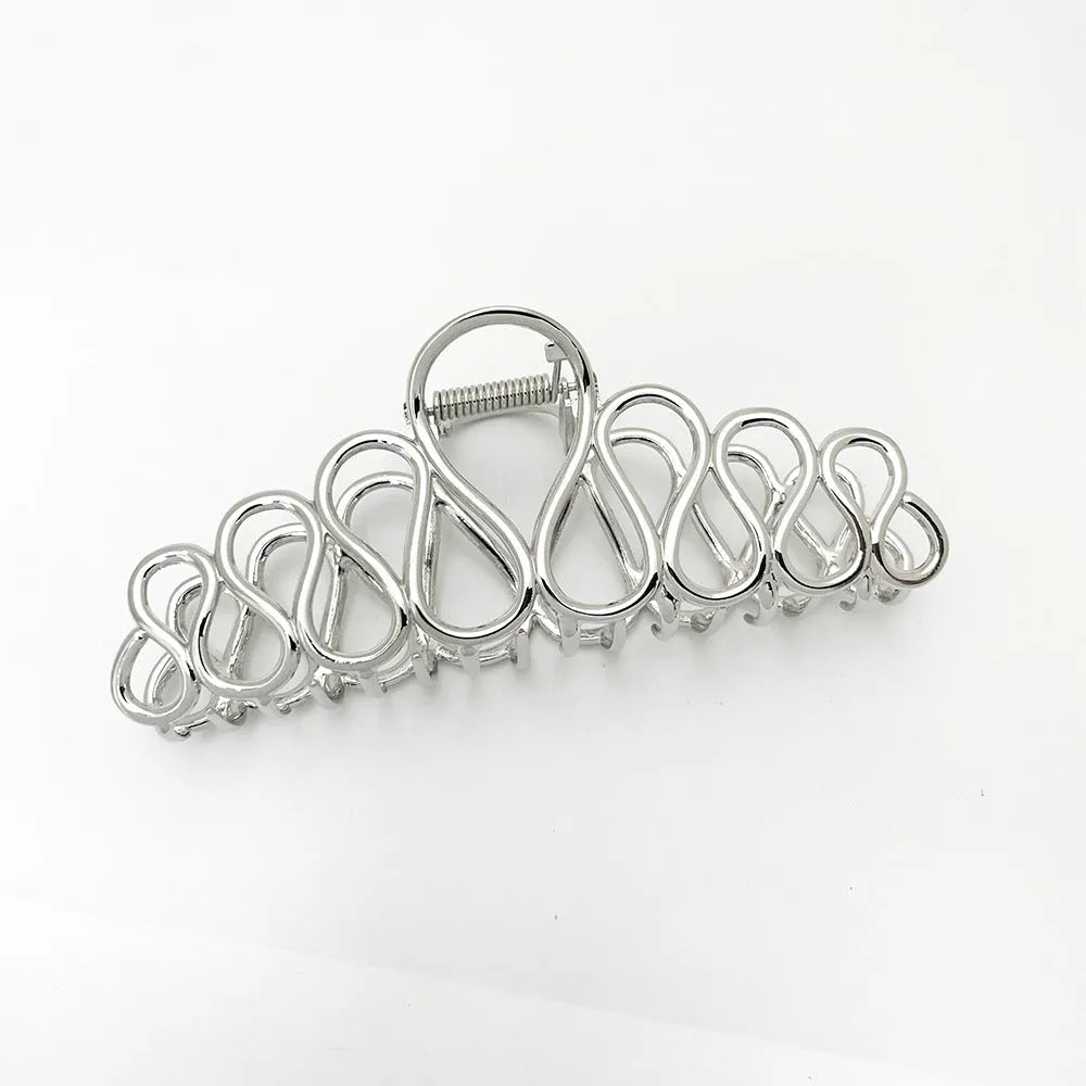 Large gold and silver minimalist hair clip with tassel detail for women's thick hair and updos.