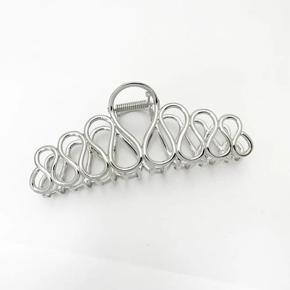 Large gold and silver minimalist hair clip with tassel detail for women's thick hair and updos.