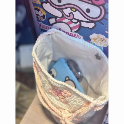 Handmade cotton crochet handbag with cherry blossom pattern and magnetic buckle closure