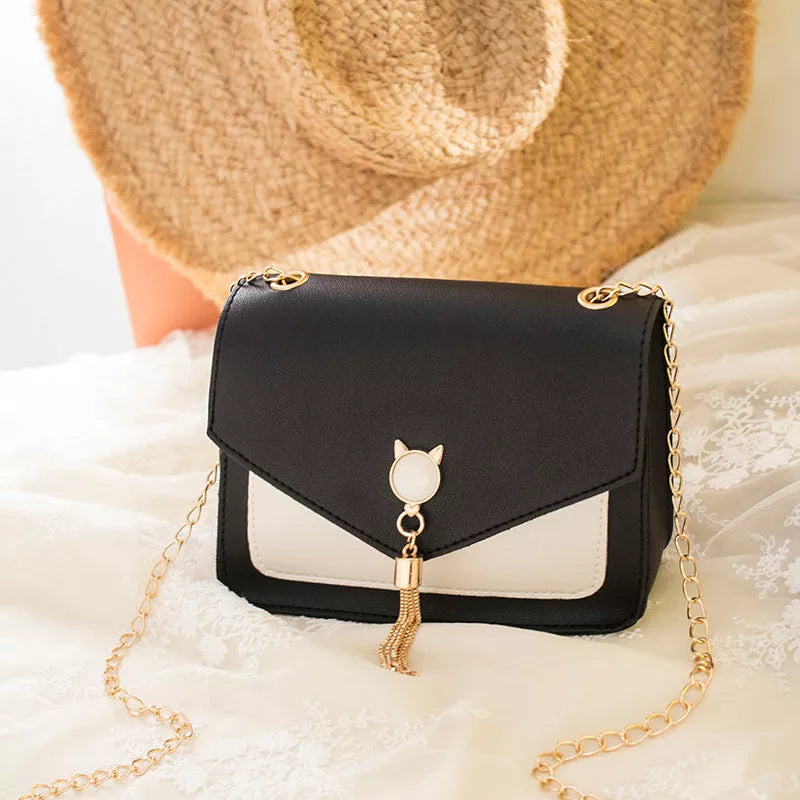 Small square messenger bag with cat tassel decoration and adjustable chain strap