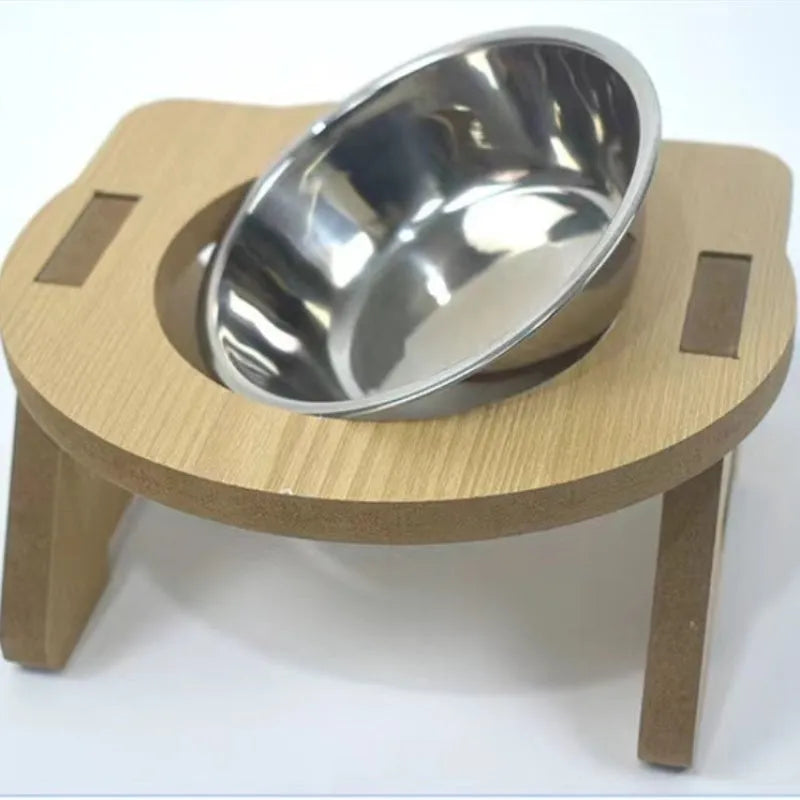 Wooden elevated cat feeder with two stainless steel bowls for food and water.