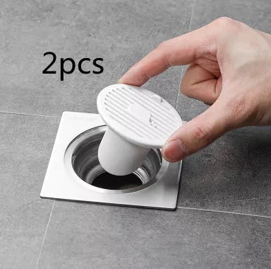 Whale Magnetic Suction Floor Drain Cover in white, orange, or green, blocking sewer odors with a tight seal