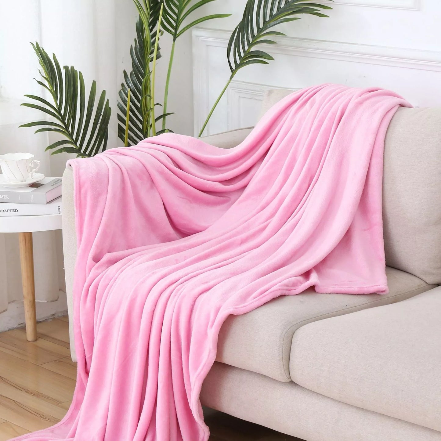 Solid color flannel blanket in various sizes and colors, made from durable polyester fiber