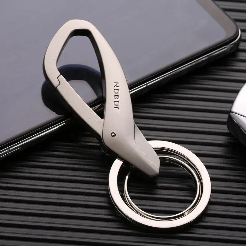 Zinc alloy double ring key chain measuring 8.3x3.5cm with black finish and modern simplicity design
