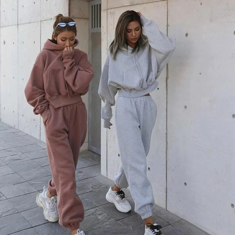 Women's casual hoodie outfit in various colors and sizes, featuring a stylish design and comfortable polyester construction.