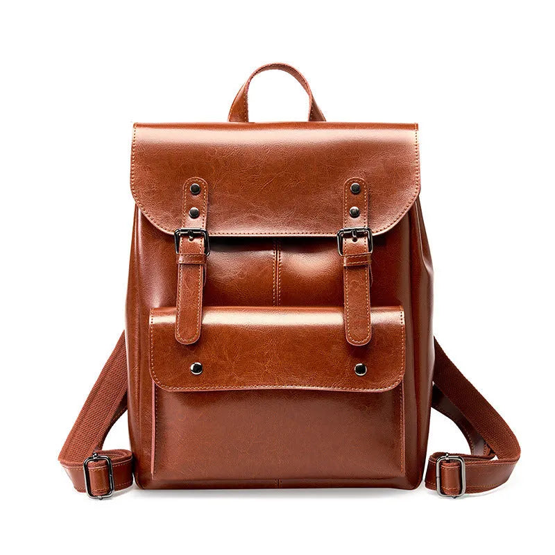 Genuine cowhide leather backpack for women in black, brown, or coffee, showing hard-textured two-layer construction.