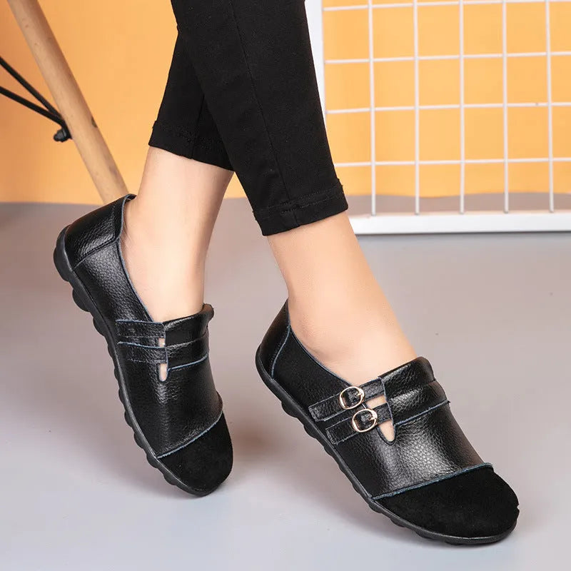 Women's low-top casual shoes in black with Velcro strap and rounded toe, showcasing cow split leather upper and beef tendon sole.