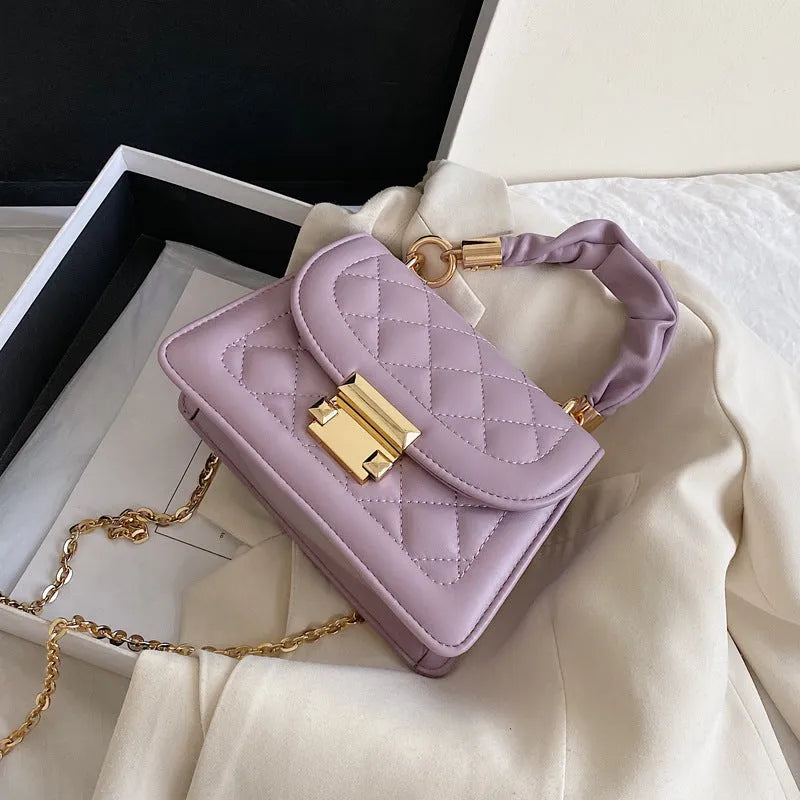 Beige rhombus-shaped women's crossbody bag with a long strap, showing front view and size.