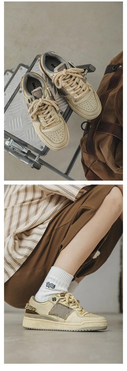 Beige low-top vintage-style skate shoes on a white background, showing round toe and lace-up front.