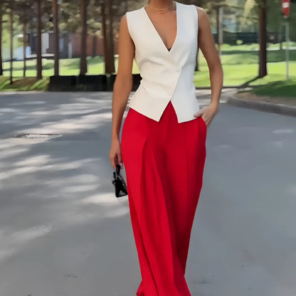 Beige women's two-piece set with sleeveless V-neck top and high-waist wide-leg trousers on a hanger.
