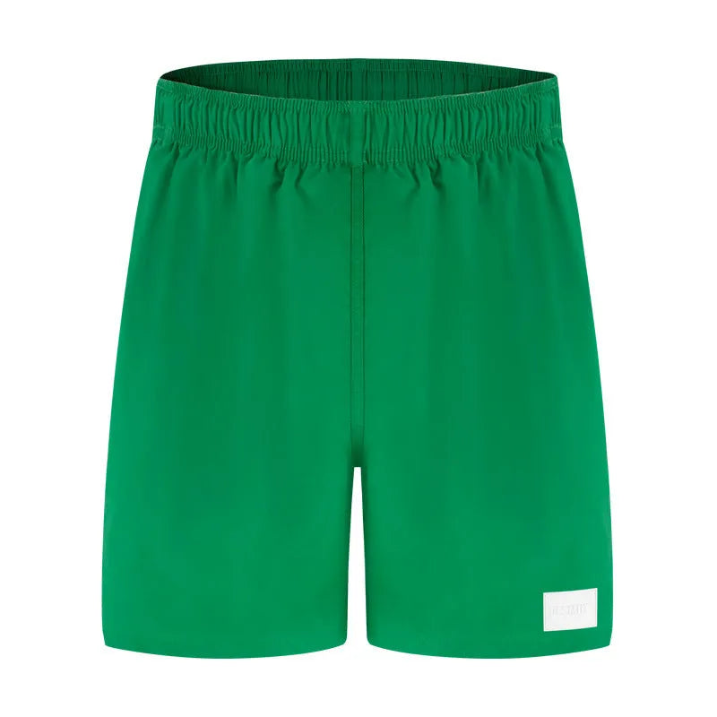 Men's quick-drying nylon beach shorts in four colours with straight leg opening