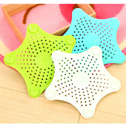 Three starfish-shaped sink drain filters in white, blue and green colours showing suction cups on bottom