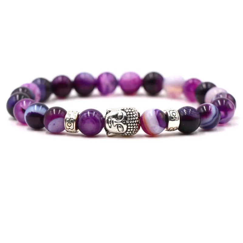 Natural stone stretch bracelet with round beads in various colours including Tigereye and turquoise.