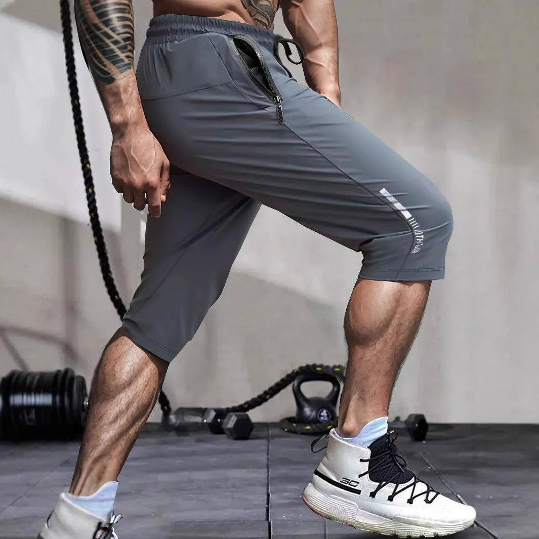 Men's cropped sports pants in quick-drying nylon with straight fit and elastic waistband