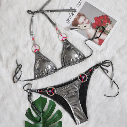 Silver women's bikini set with split-side briefs on mannequin