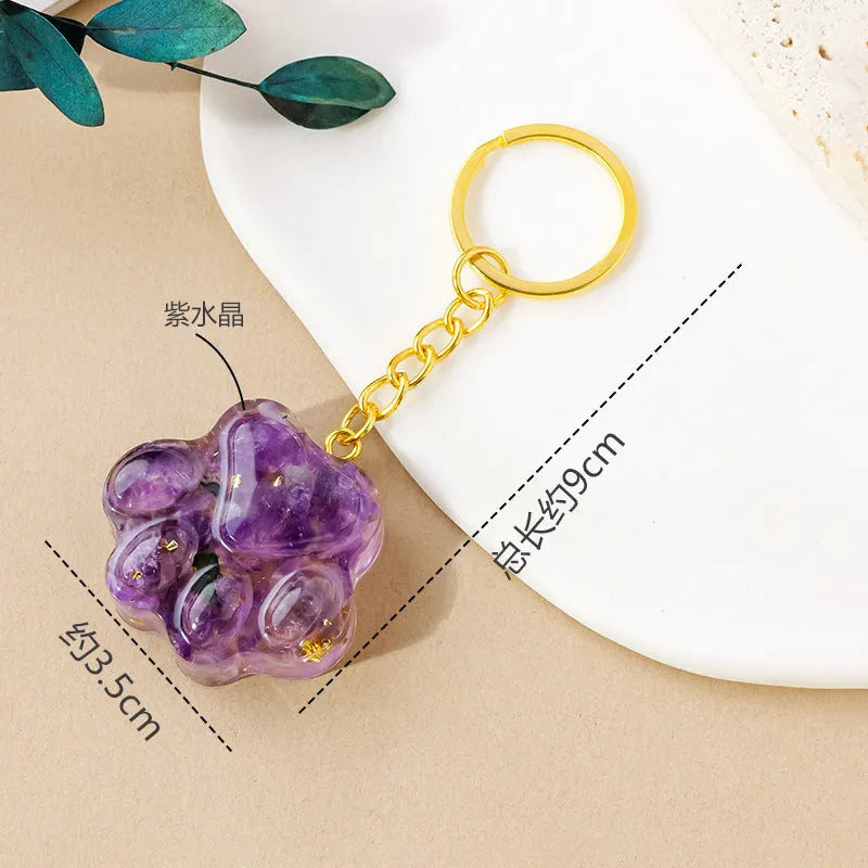 Natural crystal cat's paw keychain pendant showing gemstone options with integrated attachment loop