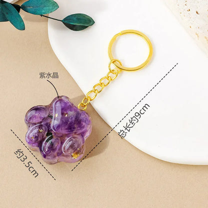 Natural crystal cat's paw keychain pendant showing gemstone options with integrated attachment loop