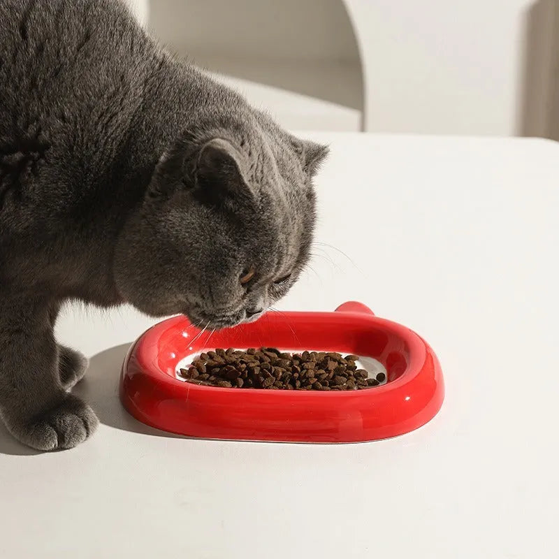 Handcrafted ceramic pet bowl with an animal design, for cat or dog food and water.