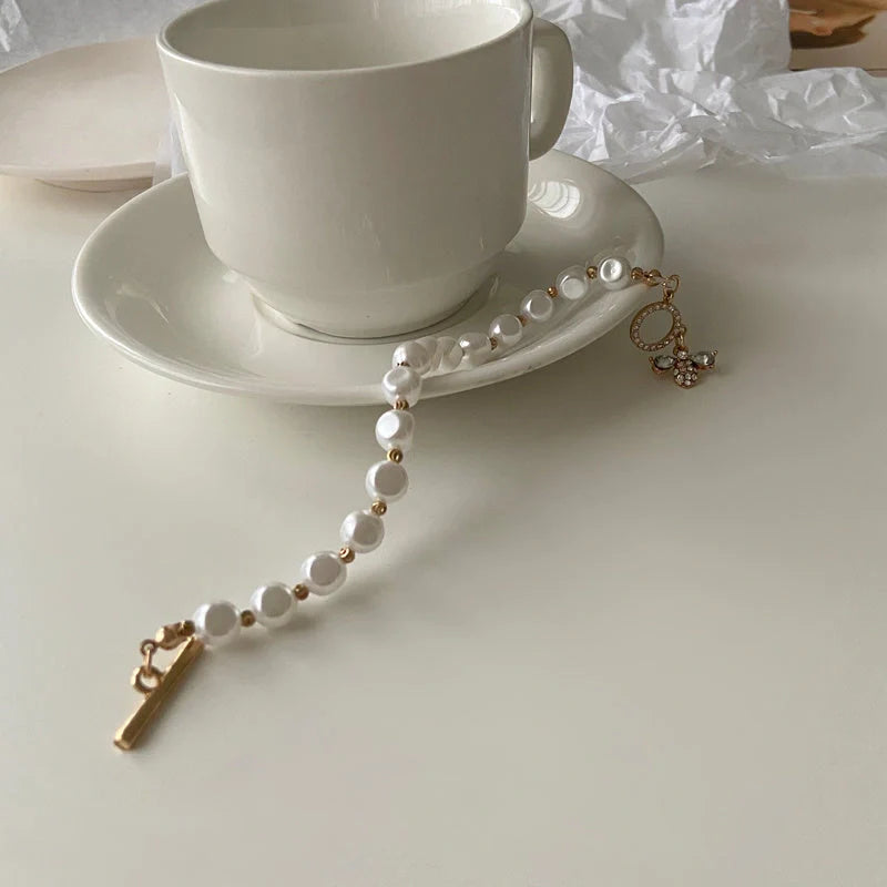 Elegant natural stone and pearl bracelet with a dazzling pendant design, perfect for enhancing any outfit