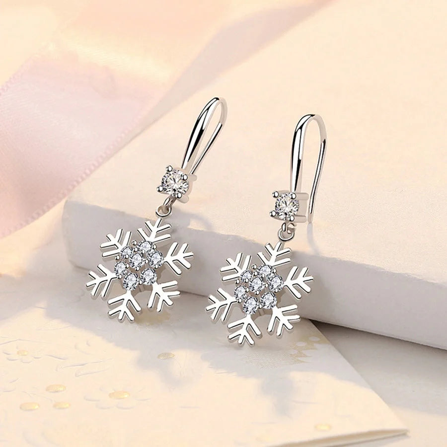 Elegant snowflake earrings with rhinestones, a personalized Christmas jewelry accessory for fashionable women