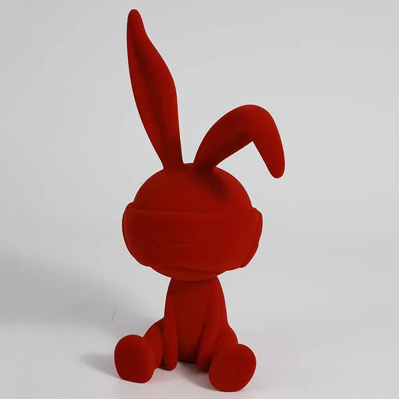 Green suede blindfold rabbit resin table ornament on a wooden shelf, showing detailed texture and 12cm height
