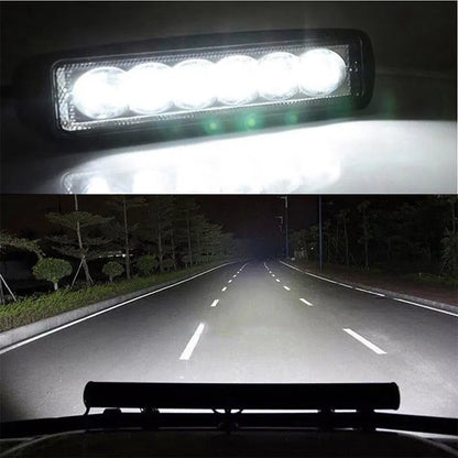 Black car auxiliary light with LED elements and bracket mounting for daytime running applications