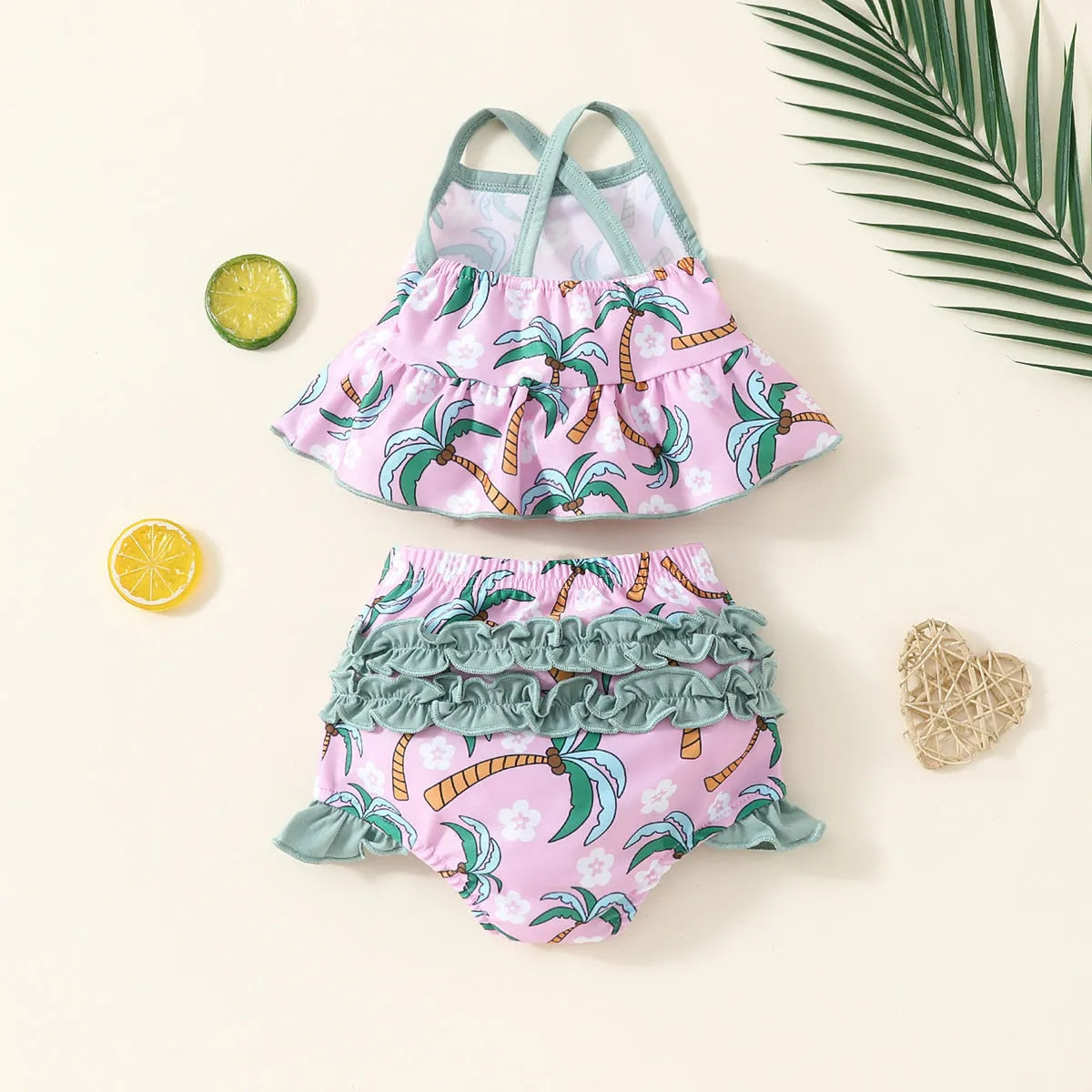 White children's two-piece polyester swimsuit set with a top and shorts on a hanger.
