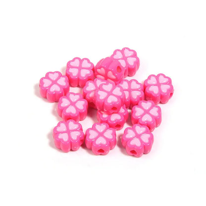 Assorted frosted acrylic four-leaf clover shaped beads in pink, green, and yellow, 15mm diameter.