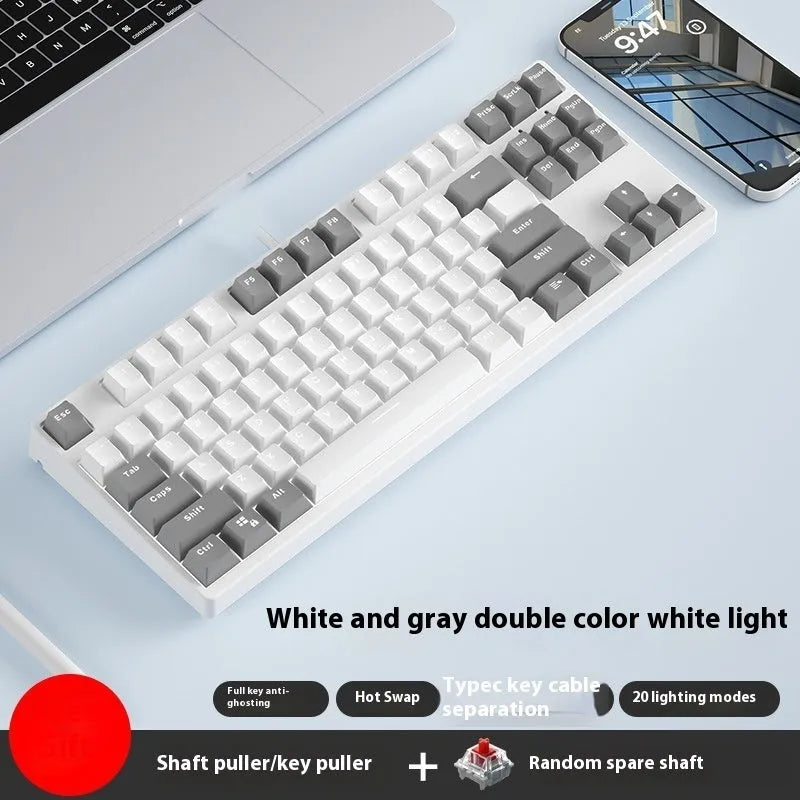 87-key mechanical keyboard with two-tone coloured keycaps on metal case