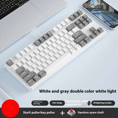 87-key mechanical keyboard with two-tone coloured keycaps on metal case