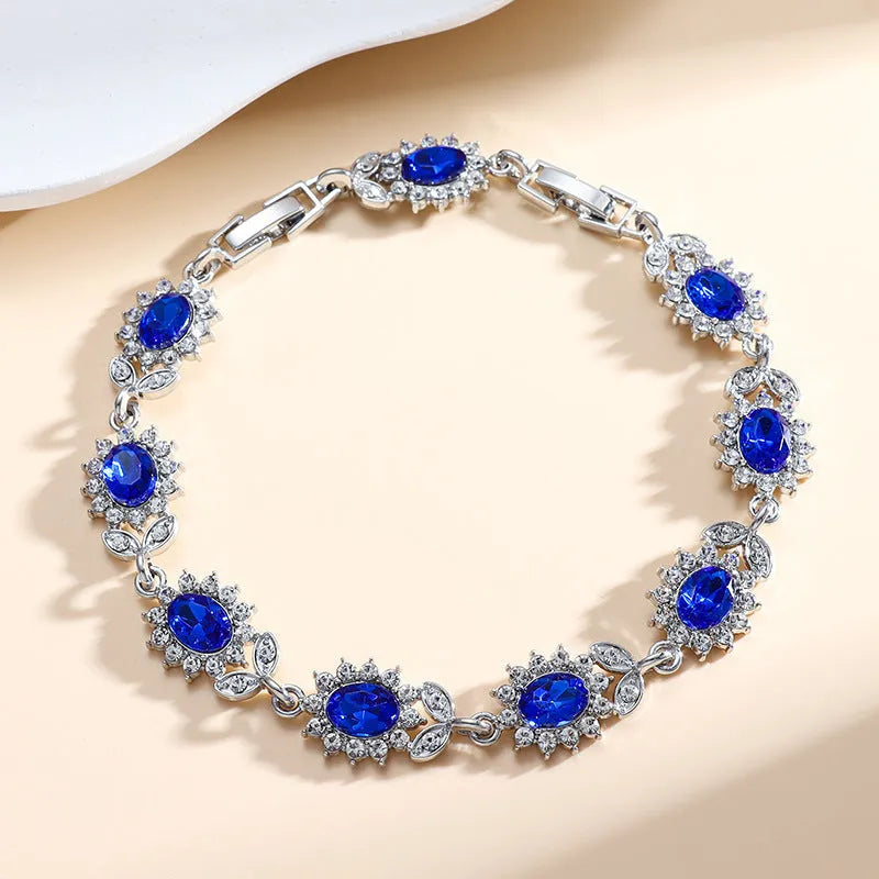 Personality Trend women's simple bracelet with inlaid zircon stones in a choice of nine gemstone colours on a wrist.