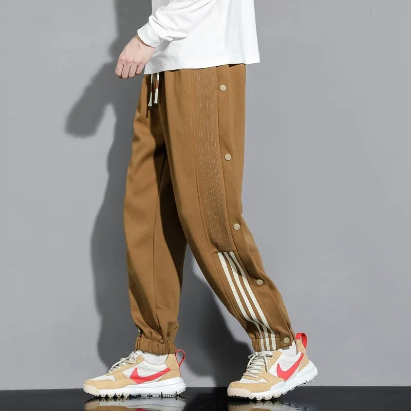Men's loose fit ankle-tied sweatpants in a cotton blend fabric on a neutral background
