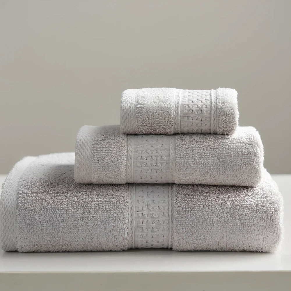 Three cotton towels: 33cm square, 32cm×73cm standard, 70cm×140cm bath towel in coordinated colours