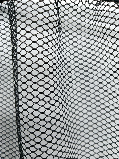 A stretchy polyester car boot storage net in a vehicle trunk, holding loose items securely.