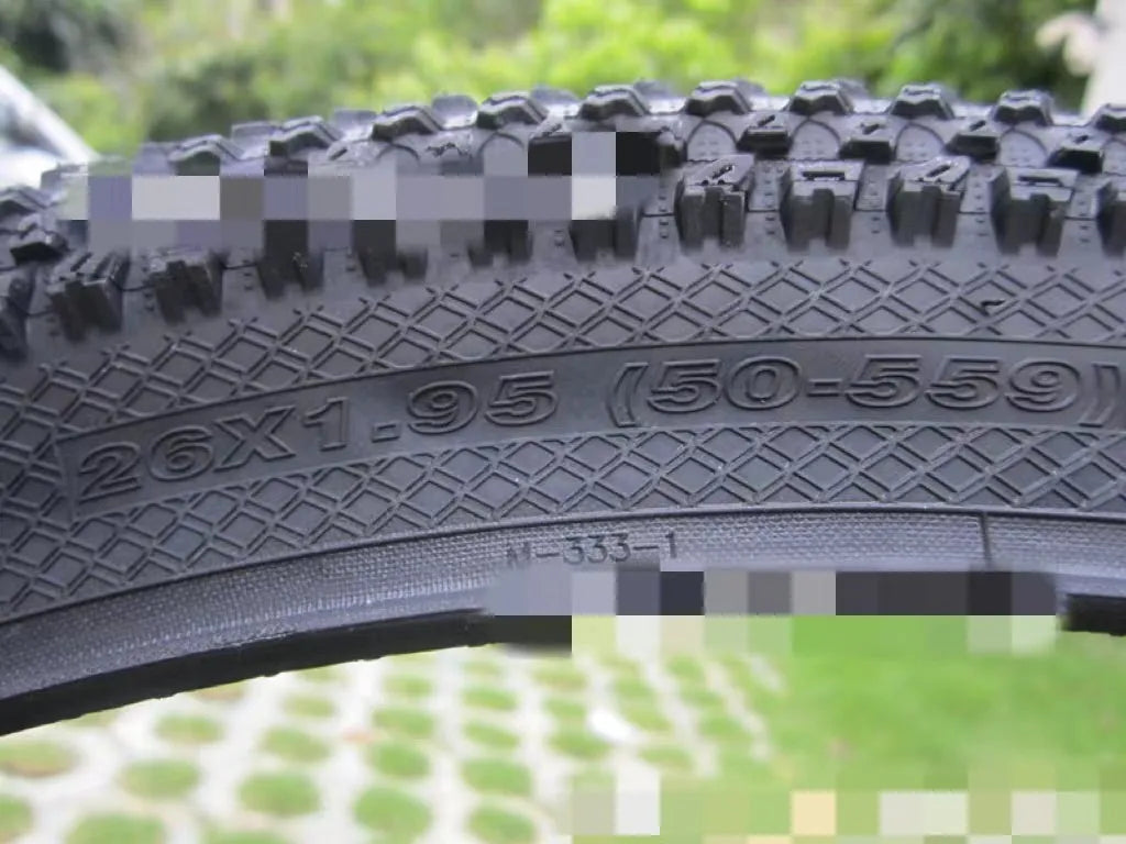 Mountain bike tyre with ultralight design, showing tread pattern and white label option, sizes from 26 to 29 inches.