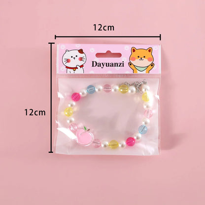 Colourful plastic bead cat necklace with adjustable clasp showing peach, rainbow, and small flower pattern options