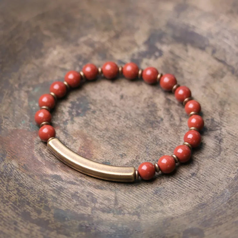 Layered retro ethnic bracelet for men and women with stone beads and brass spacers.