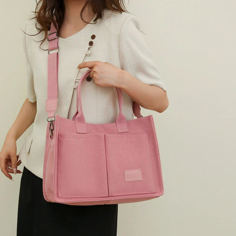 Premium canvas tote bag in multiple colors with adjustable shoulder strap and organizational pockets
