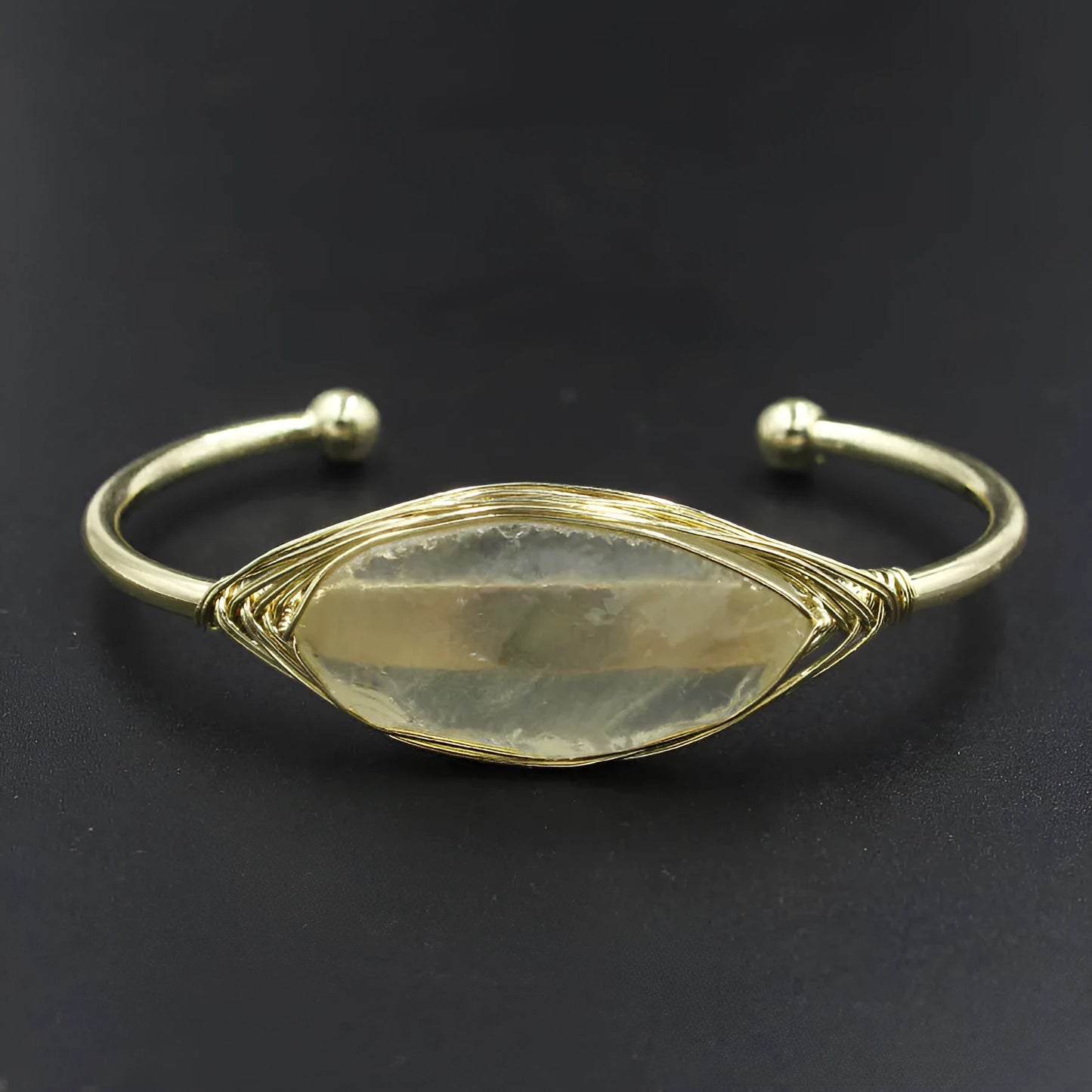 Natural raw gemstone bracelet with 8mm rough crystal beads in ethnic style, shown on wrist.