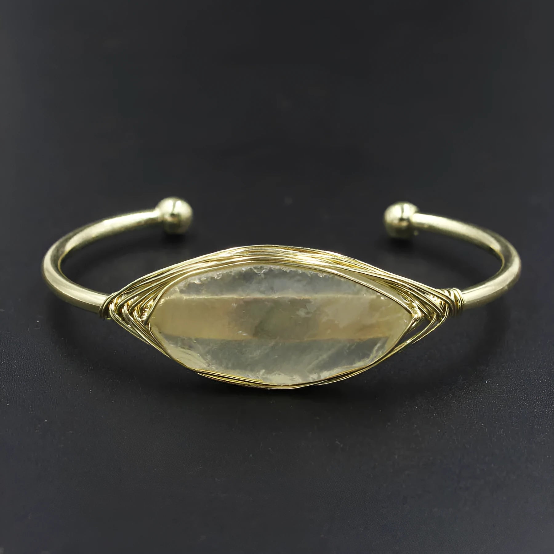 Natural raw gemstone bracelet with 8mm rough crystal beads in ethnic style, shown on wrist.