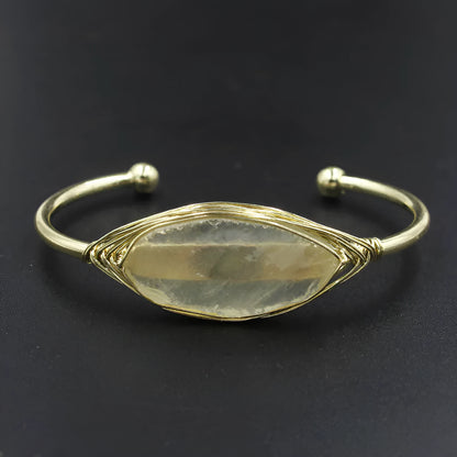 Natural raw gemstone bracelet with 8mm rough crystal beads in ethnic style, shown on wrist.