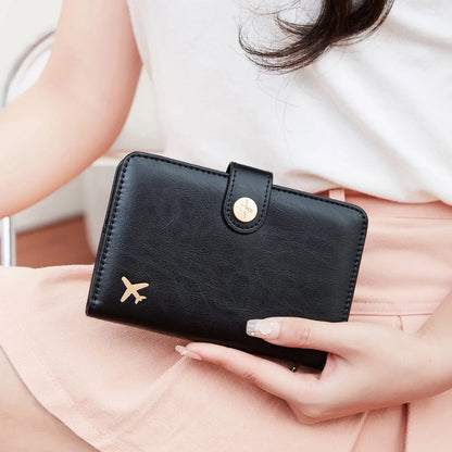 Simple PU leather passport holder in sapphire blue with visible sewing lines, showing card slots and RFID protection.