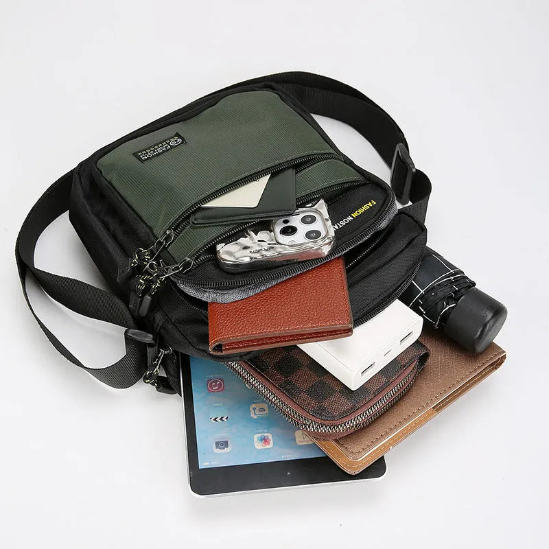 Men's green waterproof nylon crossbody bag with urban style and sewing thread detail
