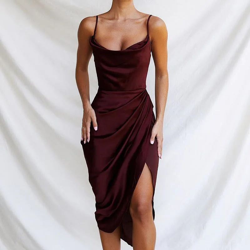 A woman wearing a satin high-waisted midi skirt in a solid colour, showcasing the sleeveless one-step design.