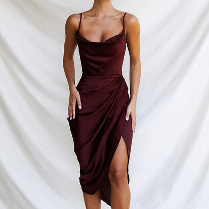 A woman wearing a satin high-waisted midi skirt in a solid colour, showcasing the sleeveless one-step design.