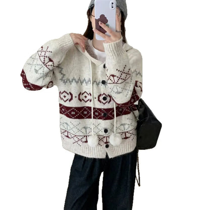 Women's loose-fit brocade sweater coat with geometric pattern in milky white colour, showing long sleeves and regular sleeve cut