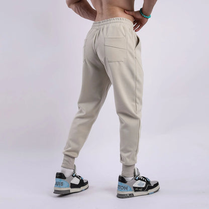 Men's casual trousers with drawstring ankle ties in polyester cotton fabric