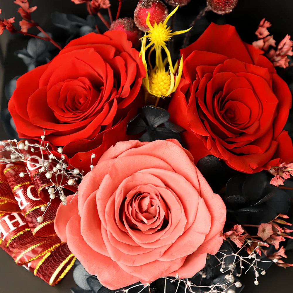 Preserved eternal flower gift box with roses, carnations, and hydrangea in red and pink colours